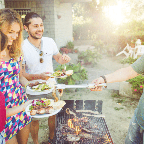 Family enjoying a backyard cookout
