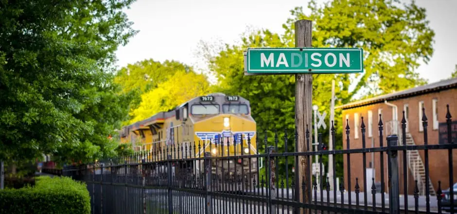 madison street sign with train in the background