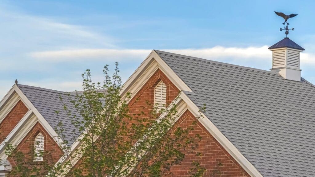 asphalt shingle roof on a red brick home
