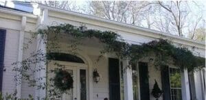 Gutter Installation Stoughton WI Large white house with vines
