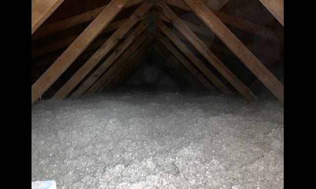 Attic with new, loose fill insulation