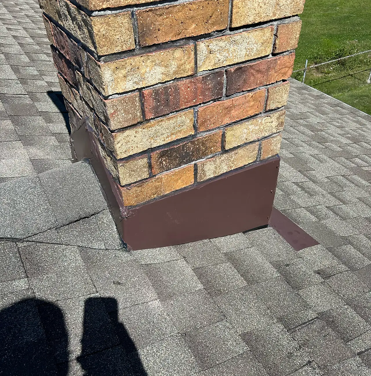 after picture of repaired chimney and roof with larson home services