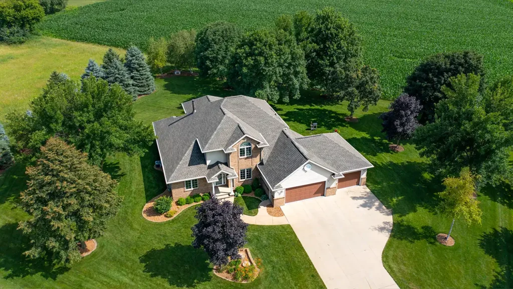 aerial view of a house with a new asphalt shingle roof