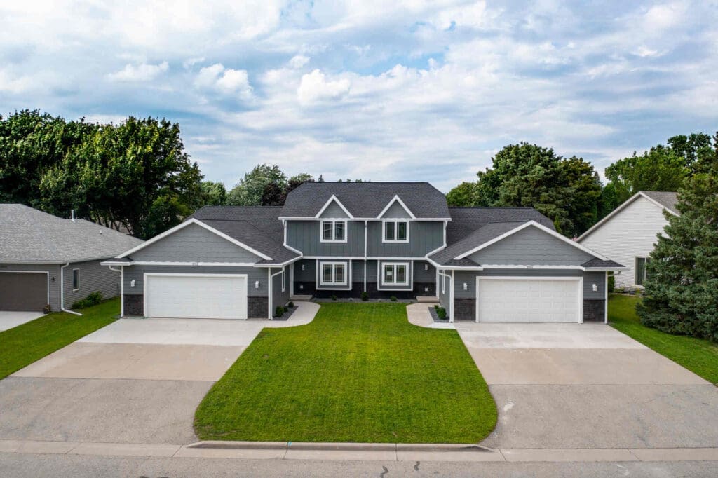 gray house with new asphalt shingle roof